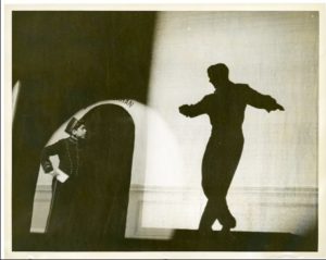 Elliott Gould as bellboy at the Palace Theater, NYC, watching Bill Callahan (dancer in silhouette). Photo courtesy of Elliott Gould