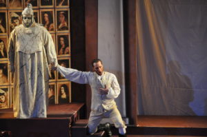 Don Giovanni (Nathan Matticks, right) is held by the Commendatore's statue (Antoine Hodge) refusing to repent for his sins. Photo by George Showerer.