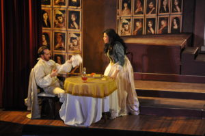 Don Giovanni (Nathan Matticks, seated) is interrupted during dinner by Donna Elvira (Zhanna Alkhazova, right) Photo by George Schowerer
